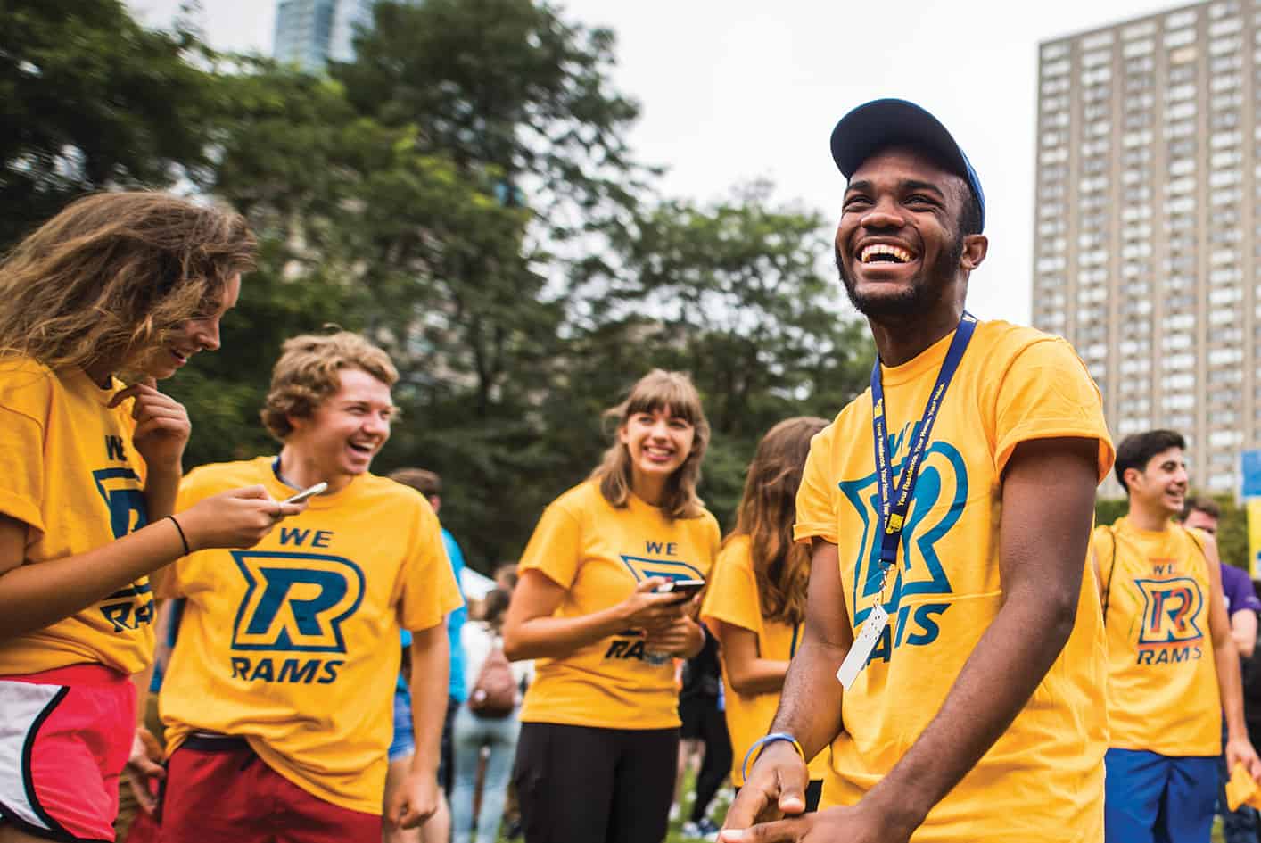 a group of students wearing we R rams shirts and smiling
