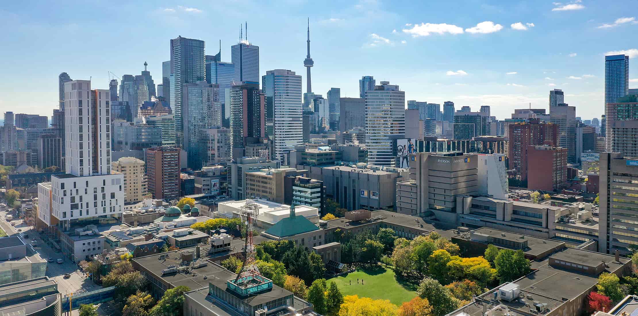 A photo of the Toronto skyline with the Toronto Metropolitan University (formerly Ryerson University) campus in the foreground