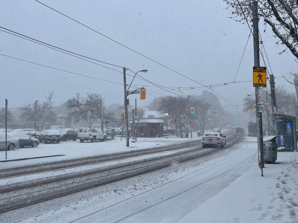 A street in Toronto in the winter, covered in snow. 
