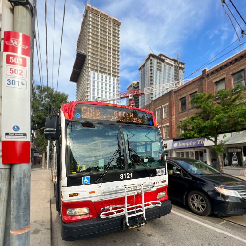 A Toronto Transit Commision (TTC) bus stops at its designated stop in Toronto.