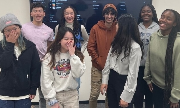 A group of TMU students laughing. 