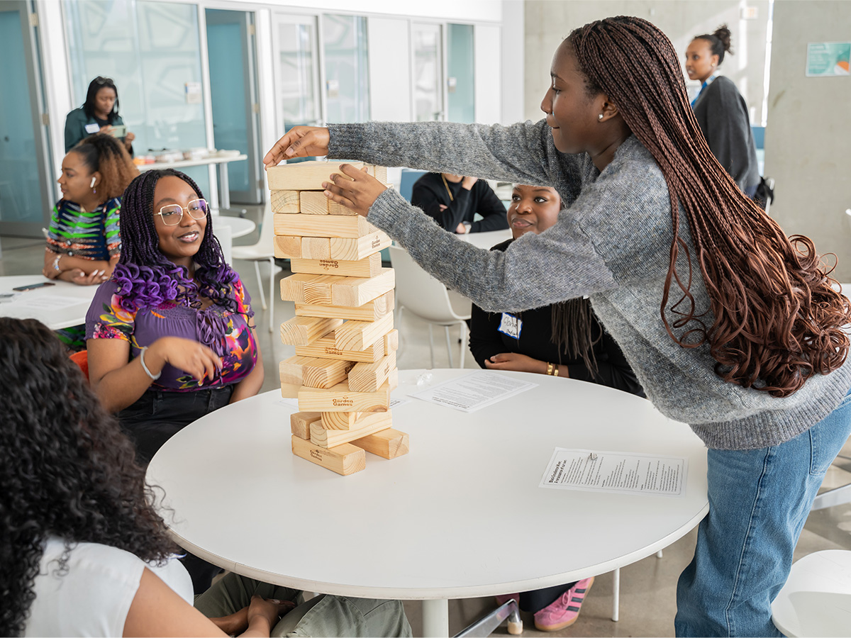 Olo Longe Playing Jenga during Black Excellence Mixer