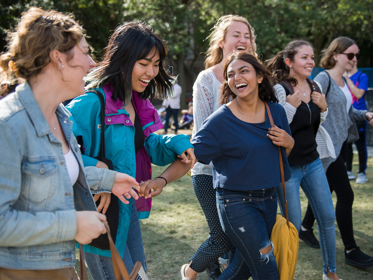 Six students walking around Kerr Hall 
