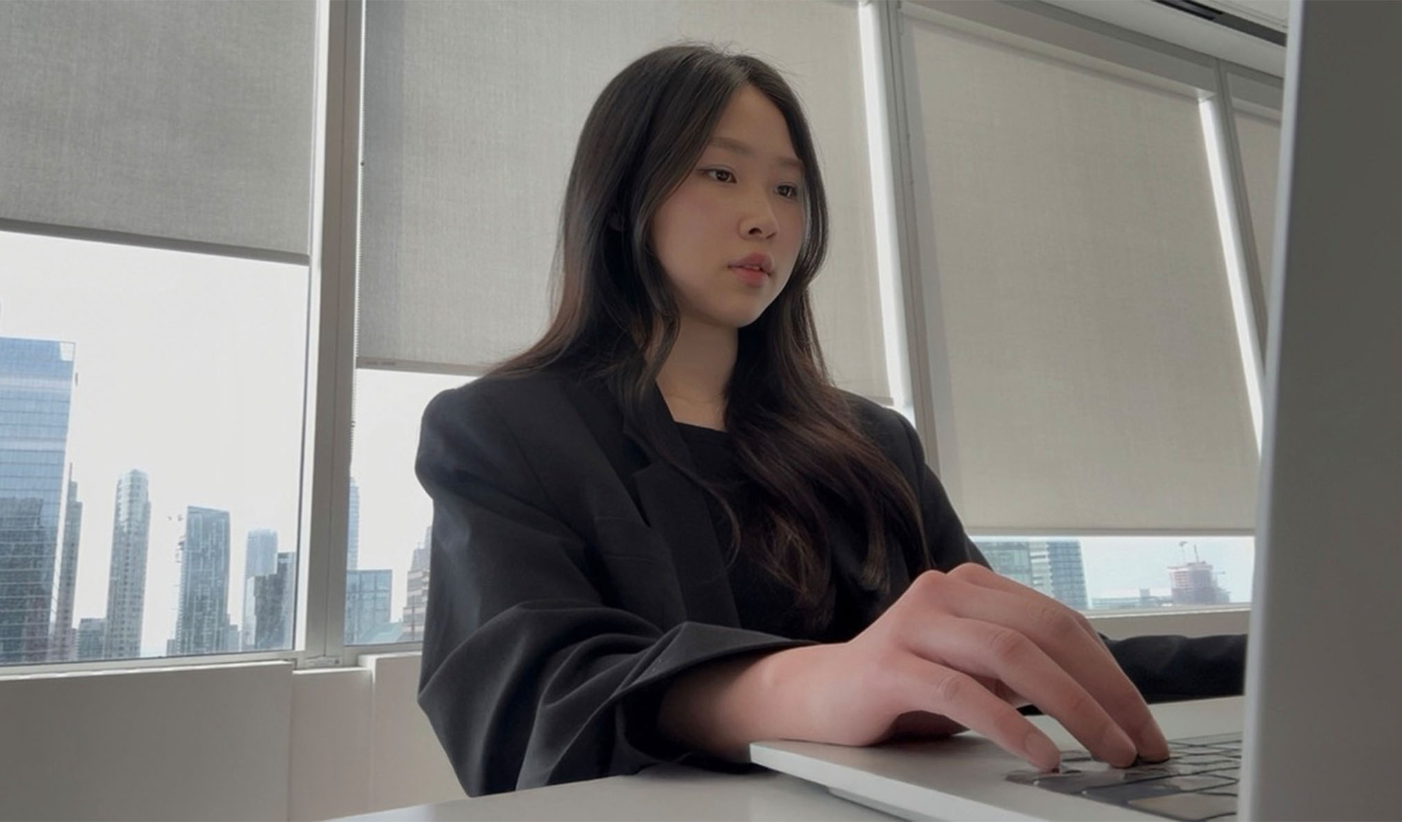 Person preparing for a presentation with the city skyline in the background
