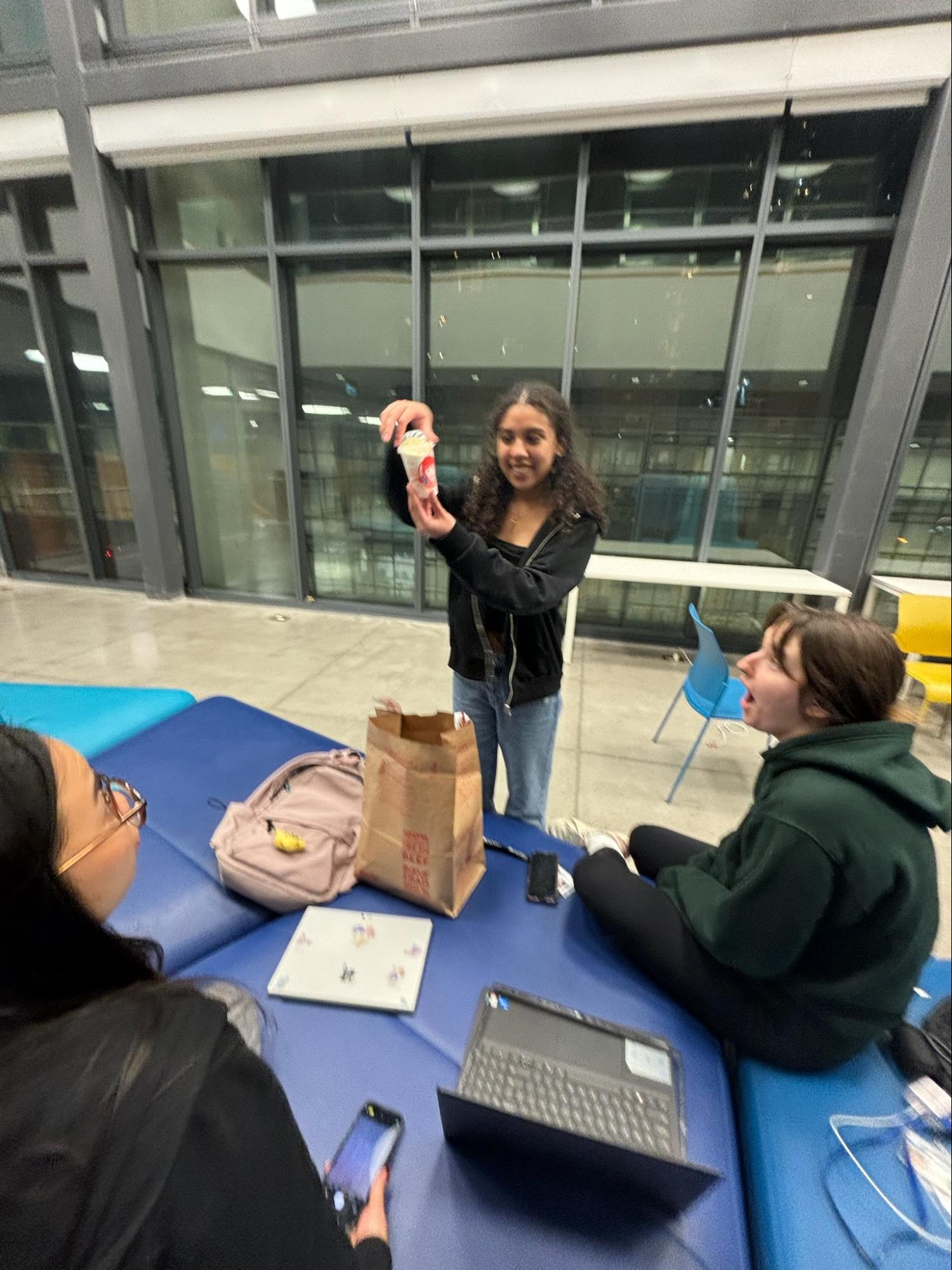 Gabby and her friends hanging out indoors