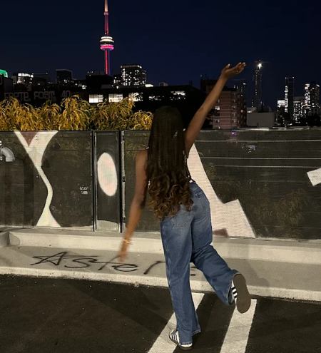 Nimi posing in front of the CN Tower