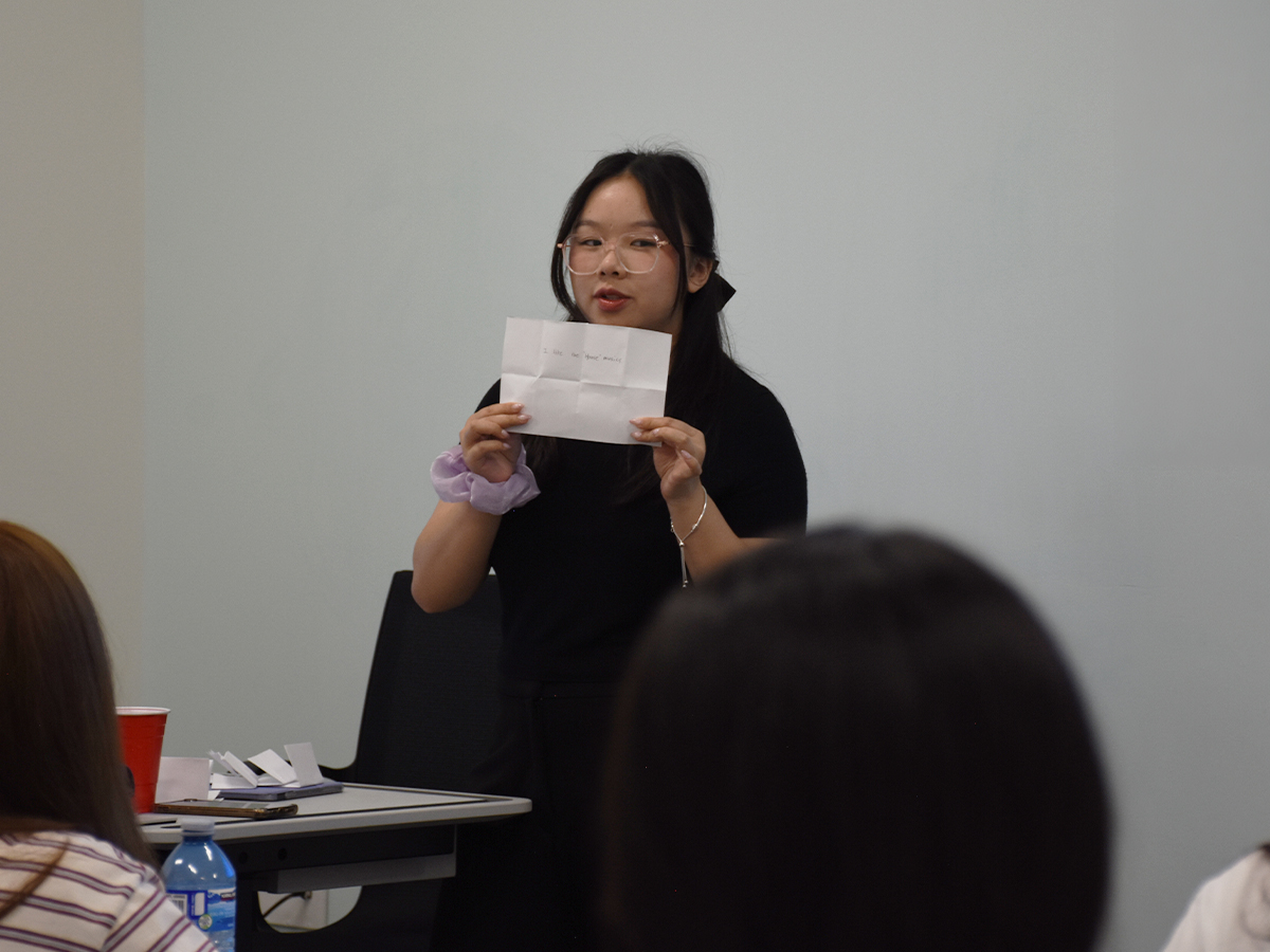 Julie presenting in front of a classroom