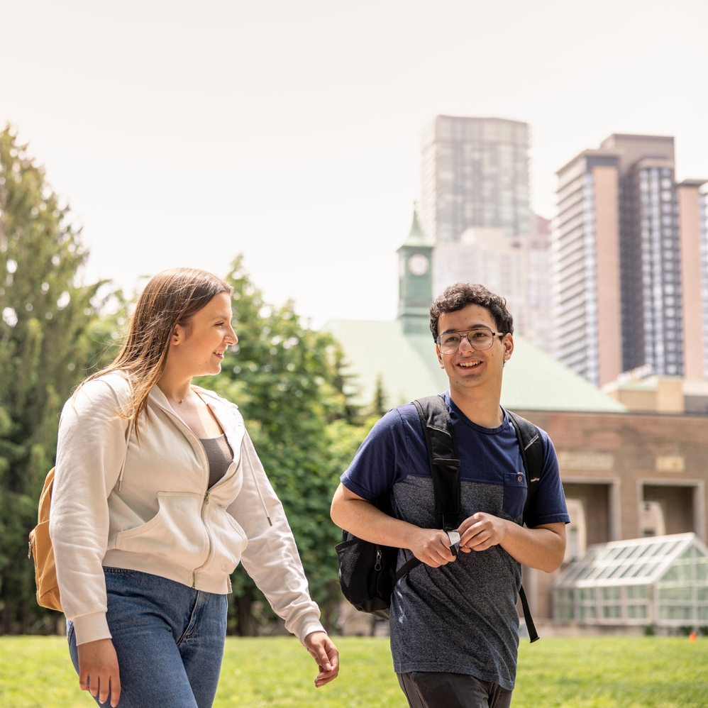 Two students walking around Kerr Hall