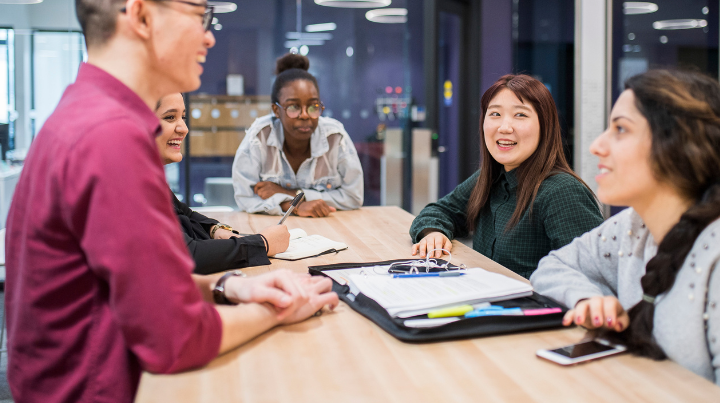Sign up for the English Language Pathway Program webinar. A group of ELI students having a discussion at the English Language Institute.