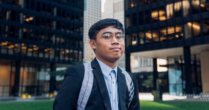 Co-op student standing in Toronto's Financial District