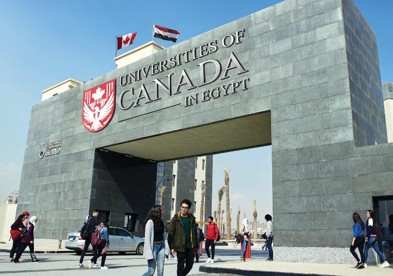 An image of students walking around the Universities of Canada in Egypt campus