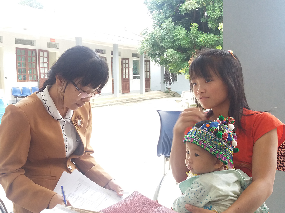 Two women in Northern Vietnam with a baby