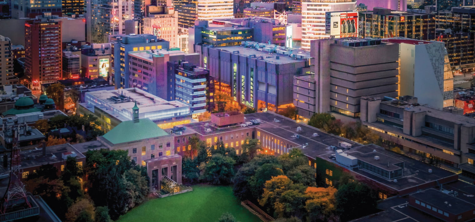 campus at dusk, located in downtown Toronto surrounded by tall buildings