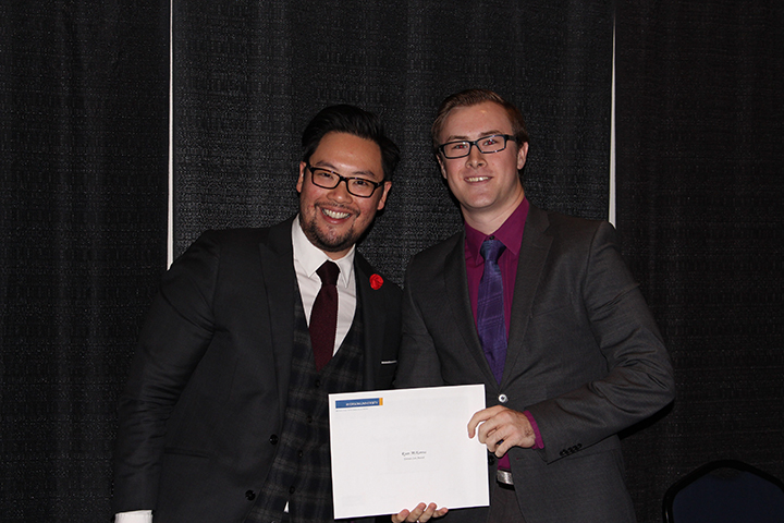 2015 winner Ryan McKenna with Awards committee member Adrian Ma.