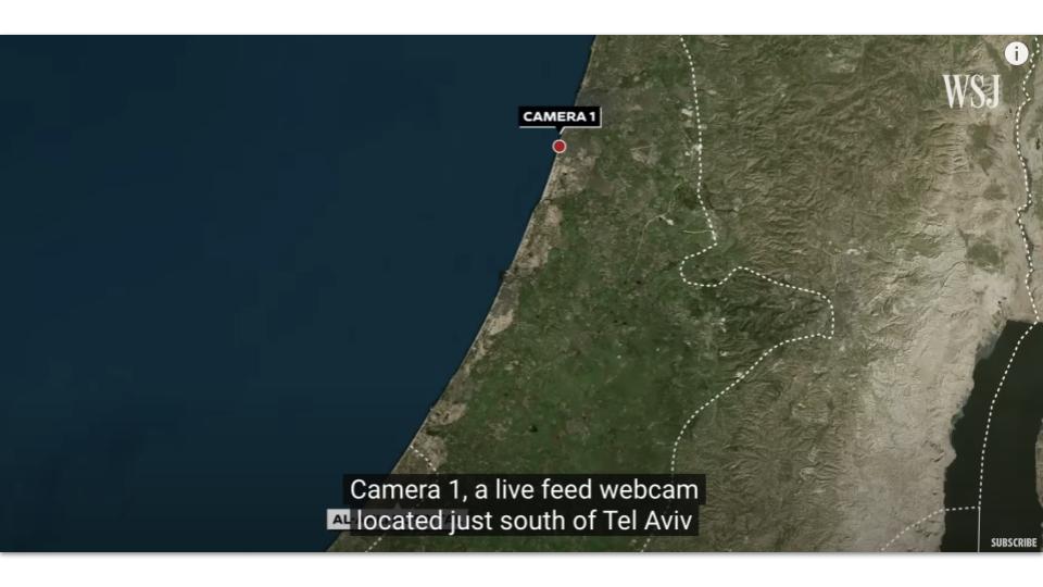 Screenshot of news broadcast report showing land.