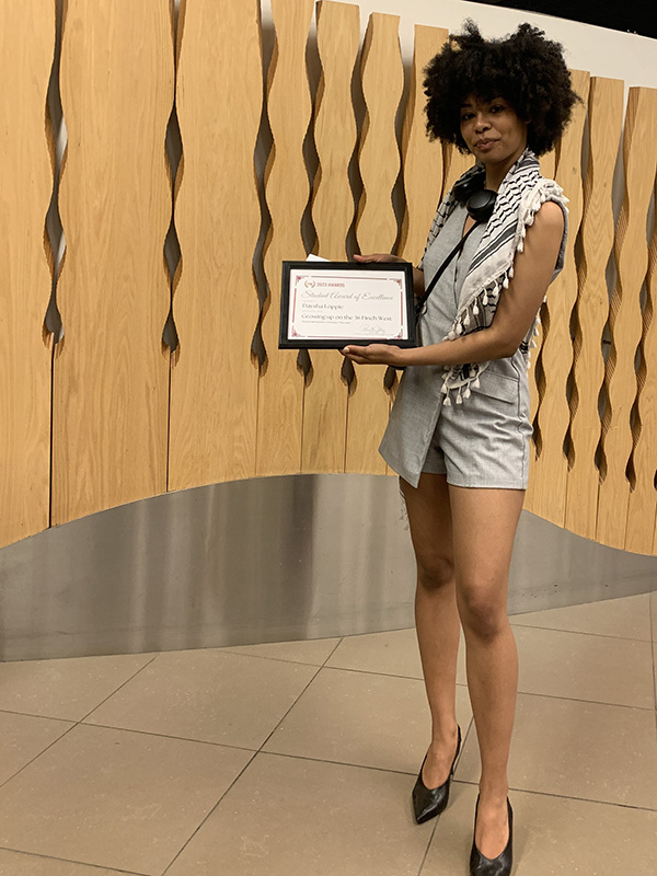 Daysha Loppie with her Student Award of Excellence from the CAJ. 