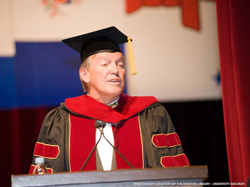 John Honderich receiving an honorary degree from the university. 