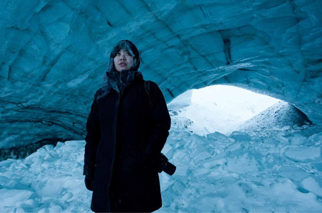 Photo of Jackie Hong in an ice cave. 