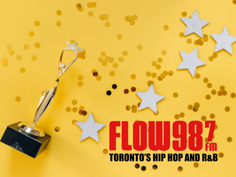 Trophy and stars with the Flow 98.7 logo on it. 