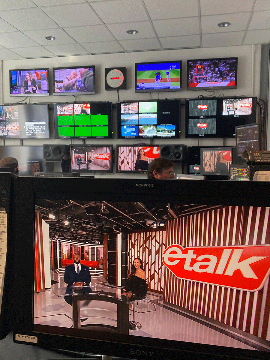 A television screen in a studio showing the etalk tv set.
