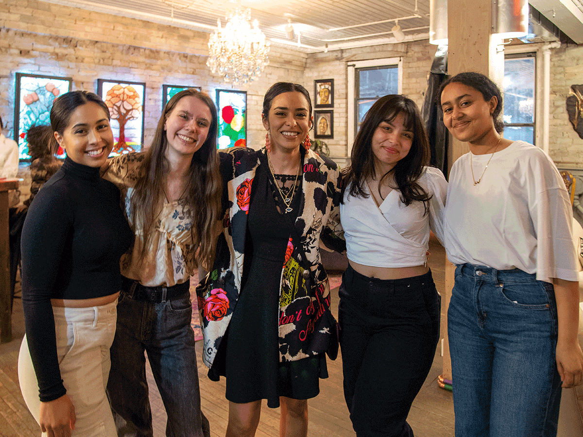 A group of five women standing for a group photo