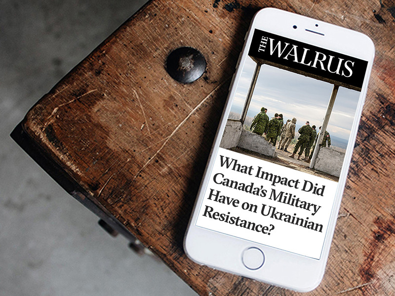 The Walrus newsletter displayed on a Smartphone, which is sitting on a wood table. 