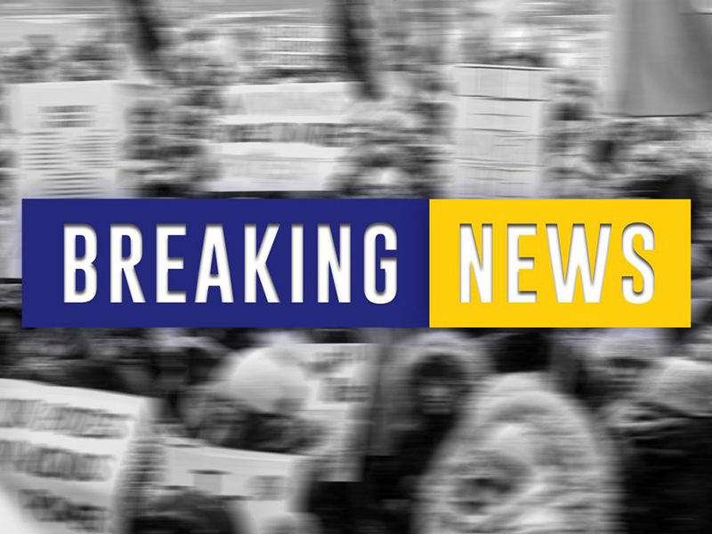 Black and white background with blue and yellow background for white text, "Breaking news."