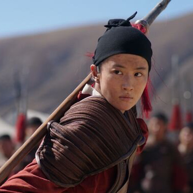 creen capture from the live action version of Mulan. Mulan is practicing fighting with a stick