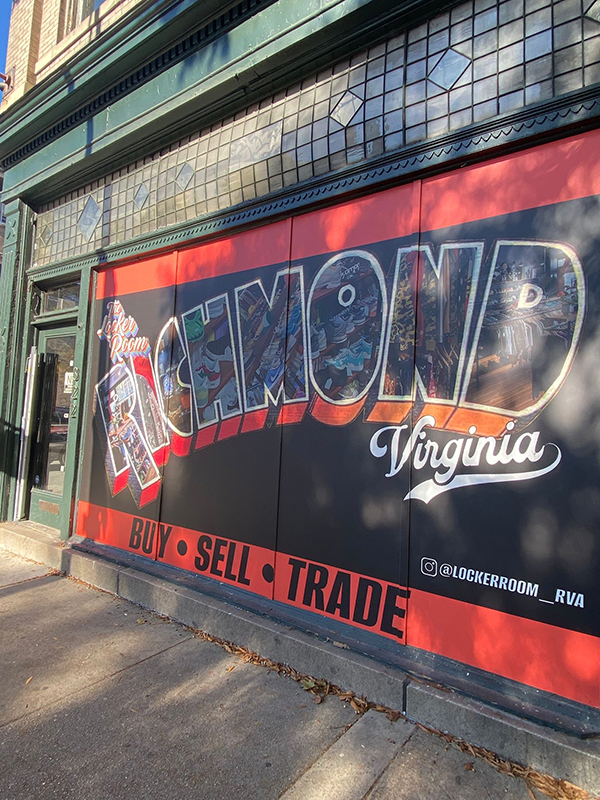 A tourist sign saying Richmond Virginia on a storefront. 