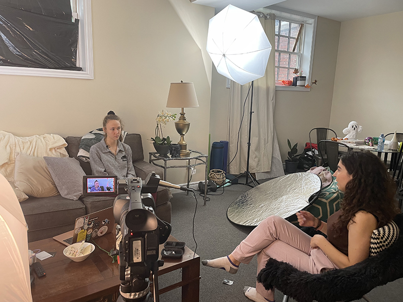 Photo of two people being interviewed across from each other in a home