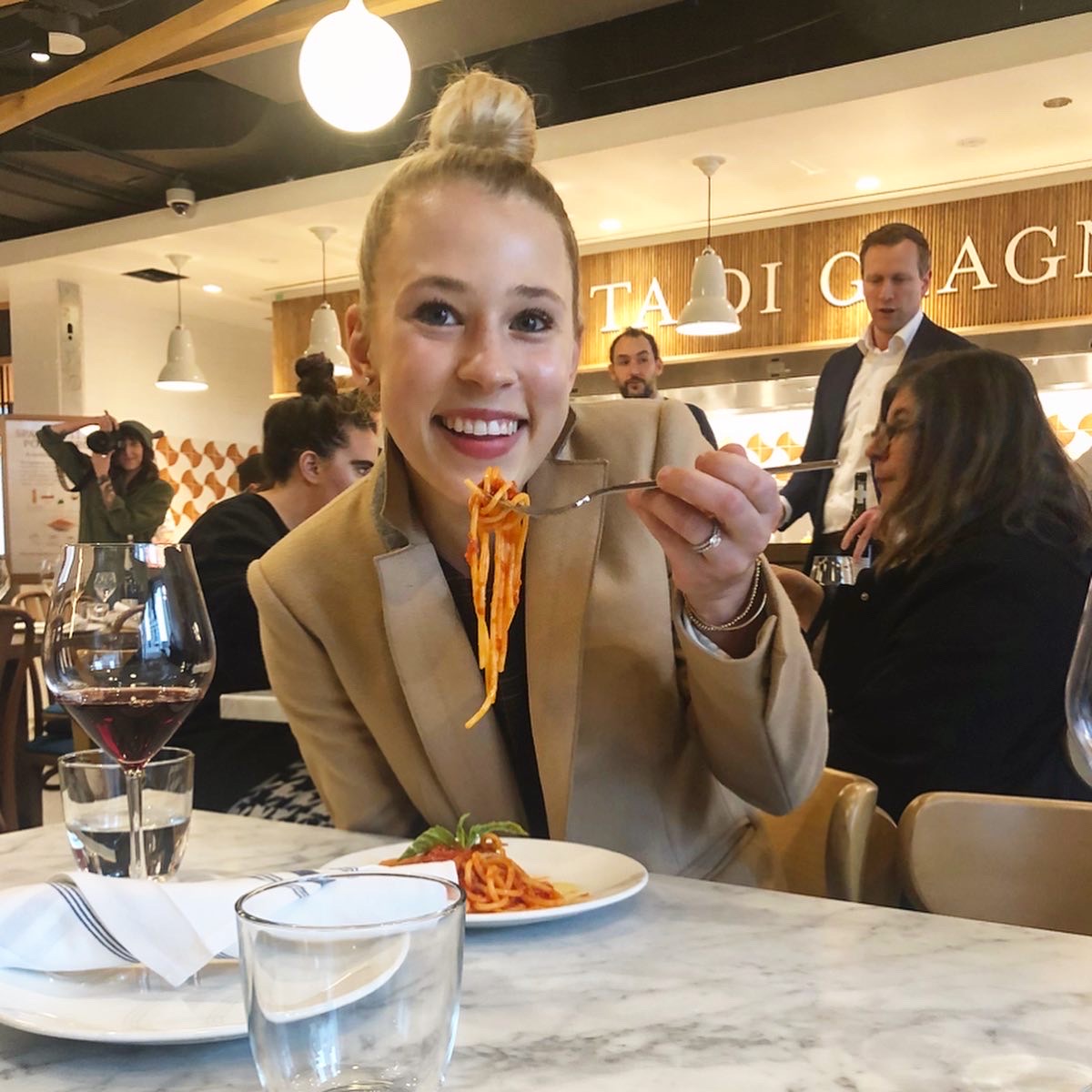 Photo of Brittany Devenyi eating pasta. 