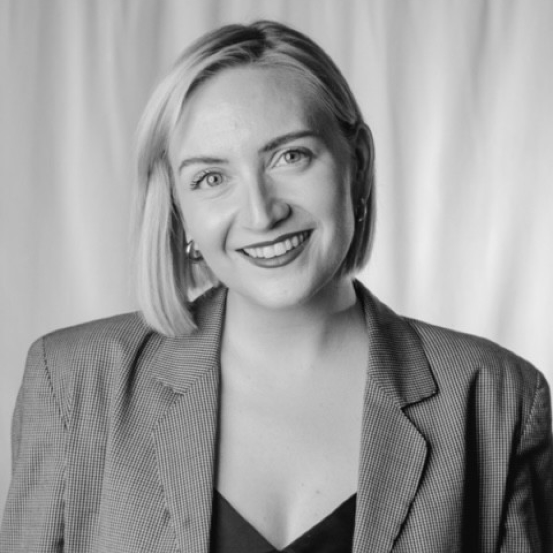 Black and white headshot of Rhiannon Howell-Matwichuk smiling