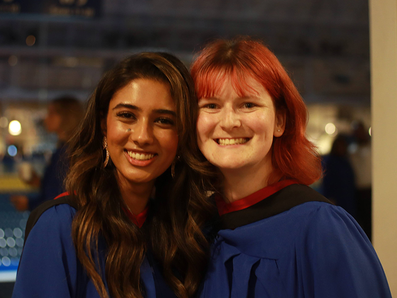 TMU J-school graduates pose for a picture after their ceremony at the Mattamy Athletic Centre