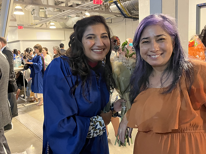 A School of Journalism 2023 graduate with Assistant Professor Angela Misri.