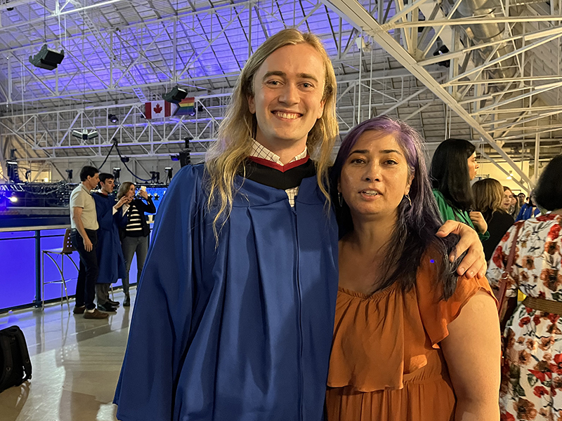 School of Journalism 2023 graduate stands with Assistant Professor Angela Misri at convocation.