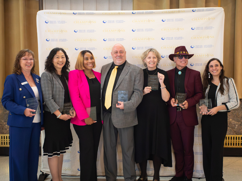From left to right: Merle Massie, Dr. Shu-Ping Chen, Amanda Coombs, Michael Perry, Susan Hyde, Sen. Patrick Brazeau, and Joanna Lavoie, recipients of the annual Champions of Mental Health Awards, pose for a group photo.
