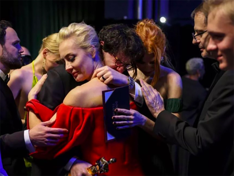 Daniel Roher and Yulia Navalnaya, wife of Alexei Navalny, embrace on stage after winning the Oscar for best documentary at the 95th Academy Awards on March 12, 2023. (Photo courtesy of Daniel Roher/Instagram)