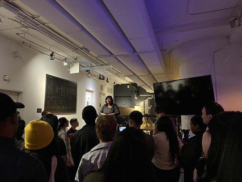 Jocelyn Yu speaks about her experience watching Living Hyphen grow at Page One Café in Toronto, on Oct. 28, 2022. (Anna-Giselle Funes-Eng/Canculture)