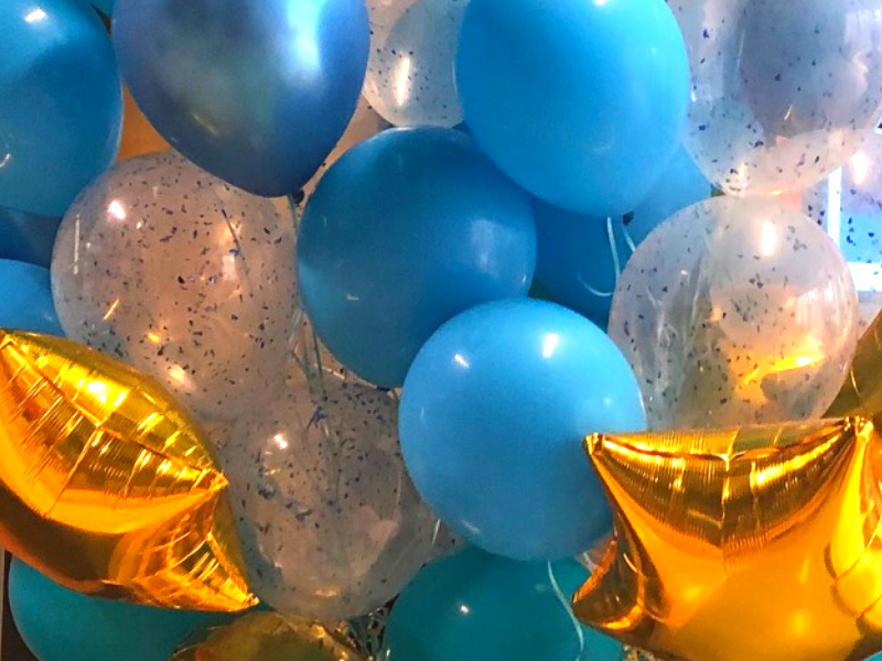 A close up of number balloons including star shaped balloons