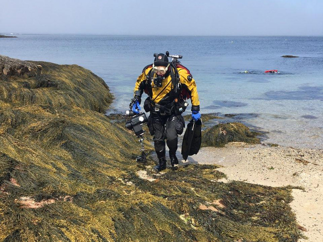 Robert Osborne getting out of the water after a scuba dive. 