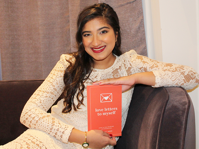 Fourth-year student Sahara Mehdi with her book of poetry: “Love Letters to Myself.”