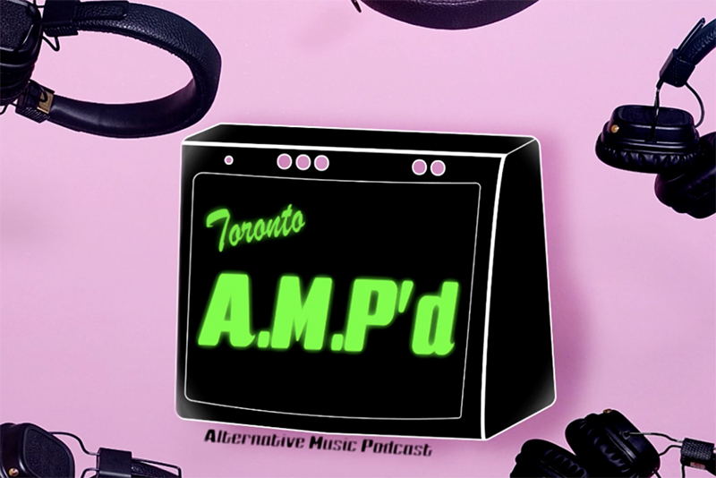 A black amp on a pink backgrounds. 