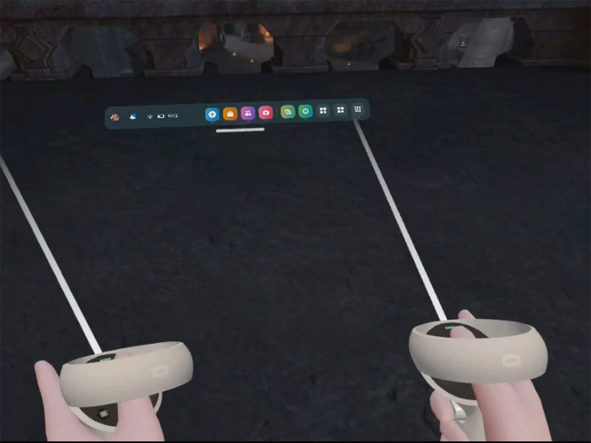 A computer screen and two hands holding remote controls