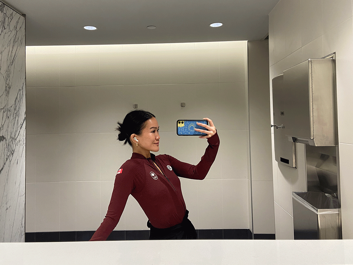 Christina Flores-Chan taking a selfie in a mirror