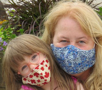 Joyce Smith and her daughter in masks Joyce made