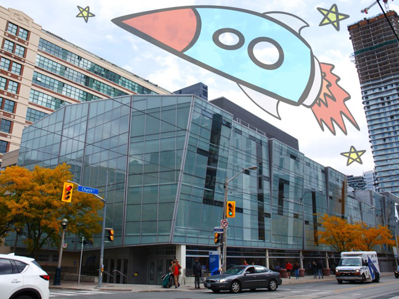 An illustration of a rocket over the George Vari Engineering building. 