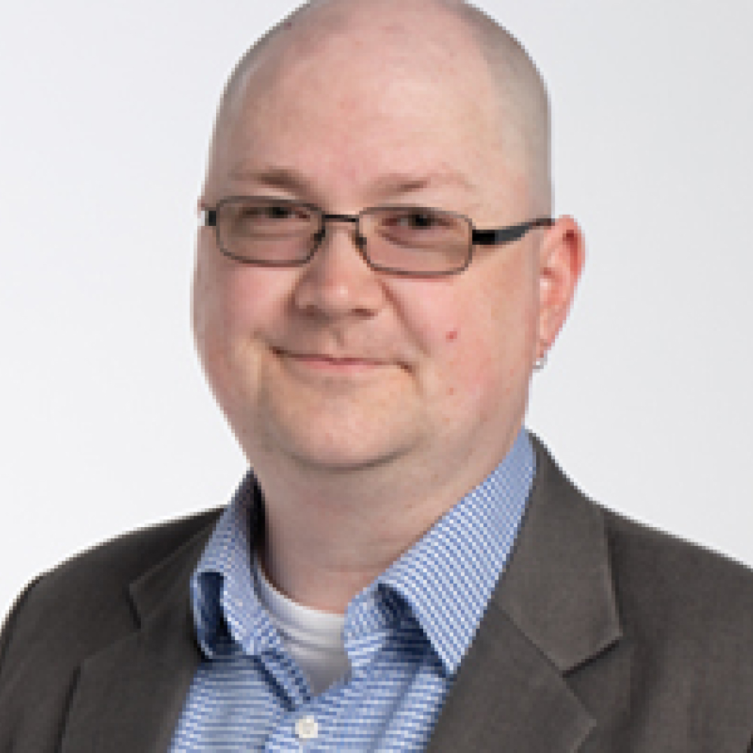 Headshot Shawn Haswell wearing glasses and smiling