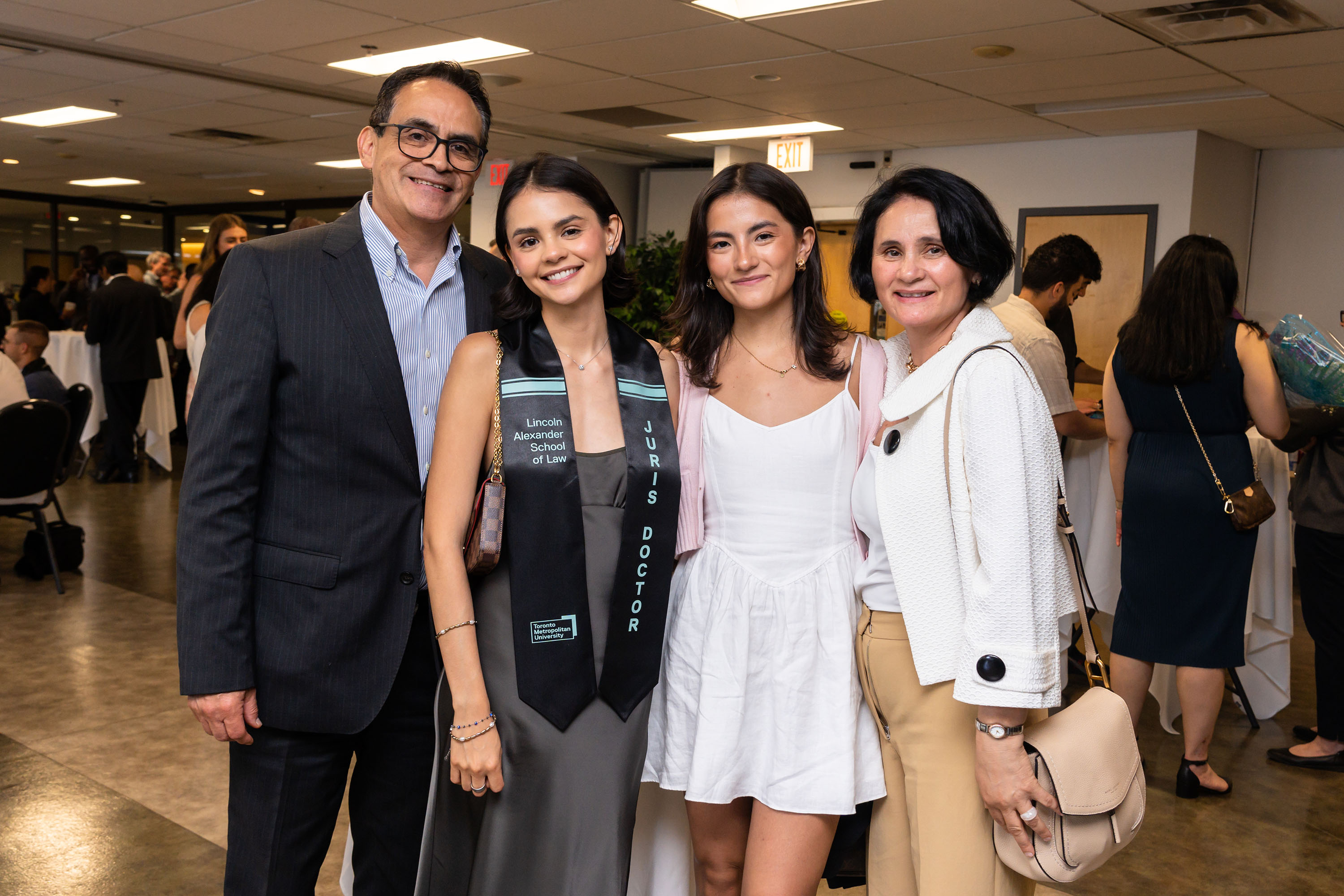 grad and family pose for photo