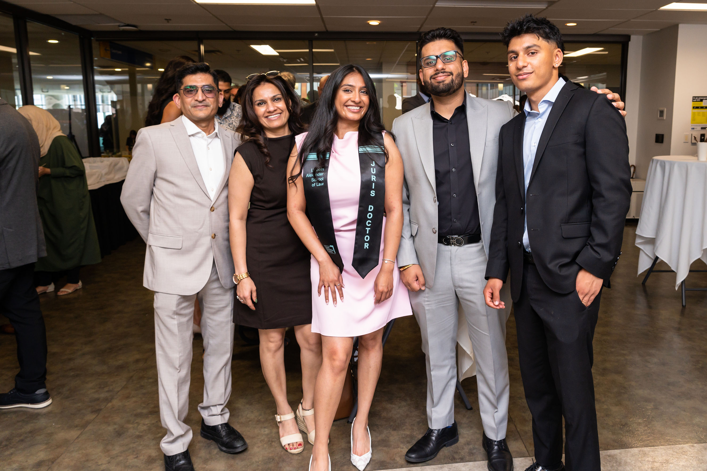 grad and family pose for a photo
