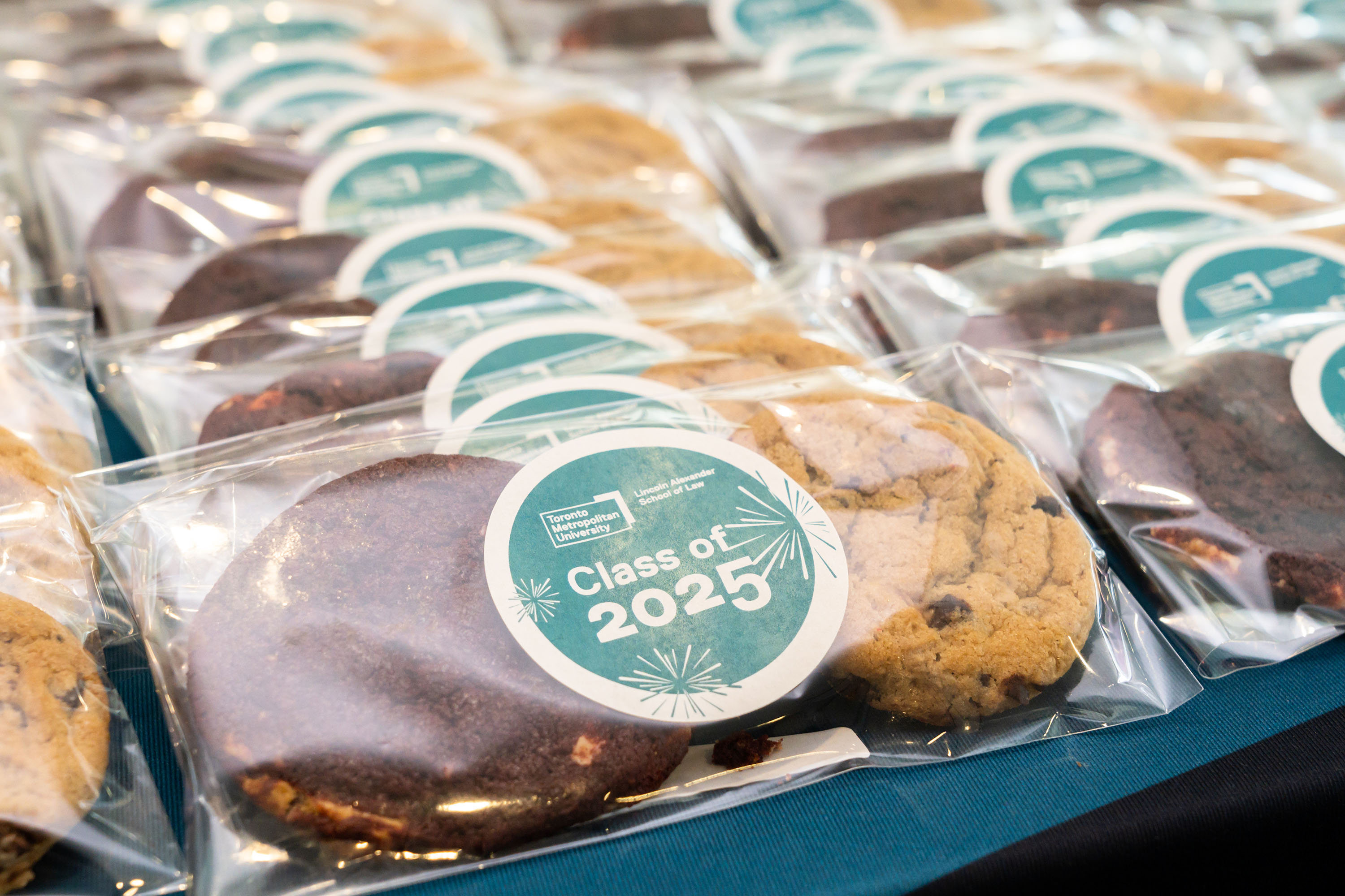 cookies with a "class of 2025" sticker on the packaging
